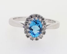 9ct (375) White Gold Oval Blue Topaz & 0.12ct Diamond Cluster Ring