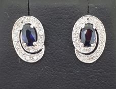9ct (375) White Gold Blue Sapphire & Diamond Swirl Stud Earrings