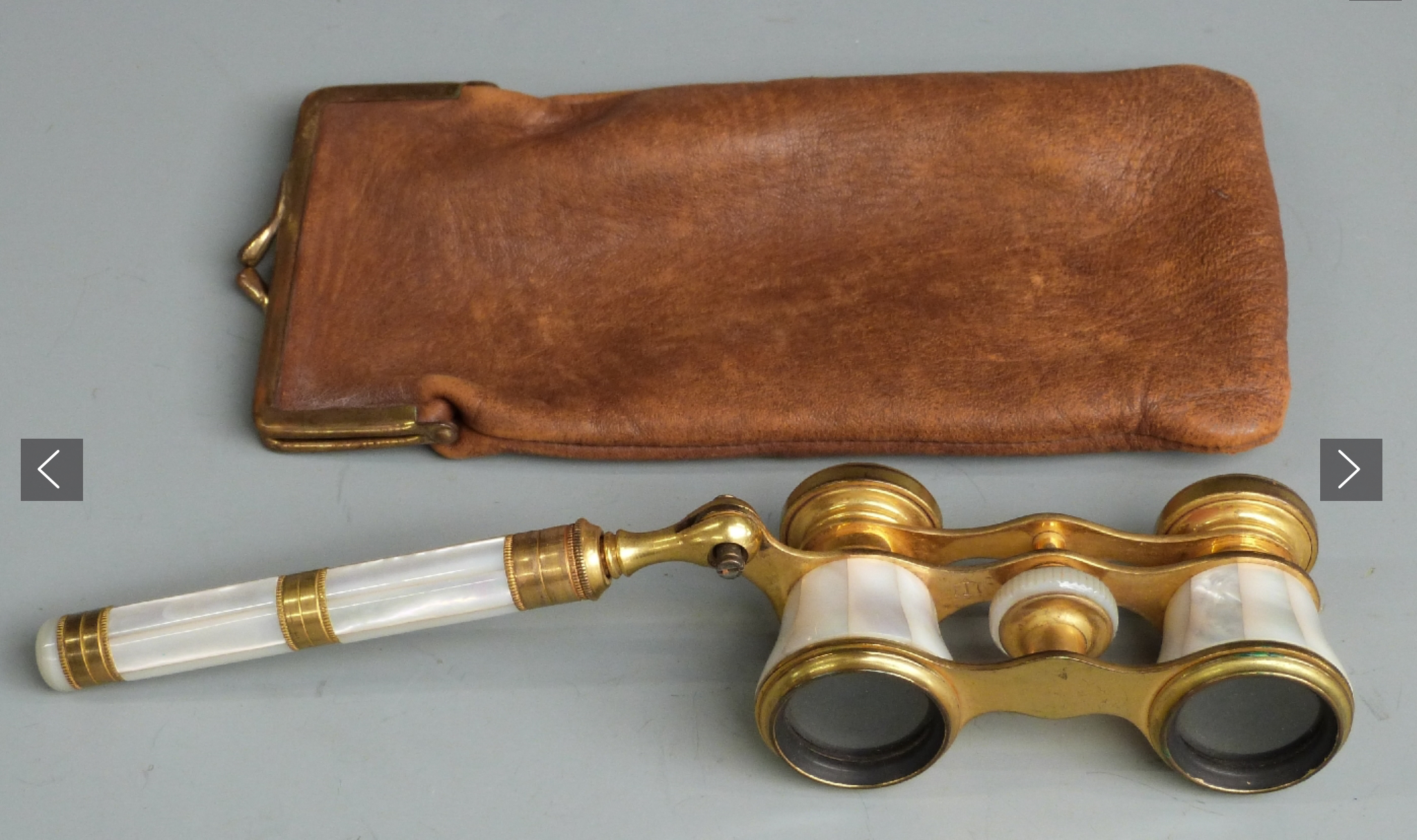 Pair of mother of Pearl opera glasses in kid-glove case