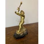 A spelter gold painted cherub on marble base