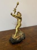 A spelter gold painted cherub on marble base