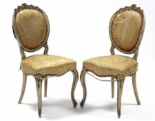 A pair of 19th century French cream & gilt painted salon chairs