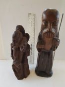 Large Wooden African Carving with Heads and a Large Farther Time