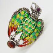 A silver plique-à-jour eagle brooch / pendant set with cabochon garnet, ruby and marcasites