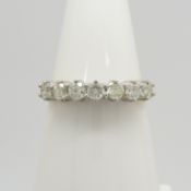 A 7-stone natural diamond ring in 18ct yellow and white gold, with WGI certificate