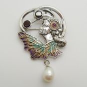 A silver plique-à-jour flora lady pendant / brooch set with a cultured pearl, garnets and a ruby.