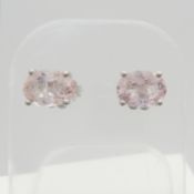 A pair of morganite and silver ear studs