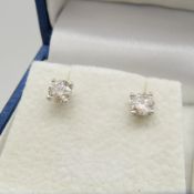 A pair of 18ct white gold round brilliant-cut 0.86 ct diamond solitaire studs, boxed.