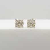 A pair of 1.06 carat diamond studs in 18 ct white gold, boxed