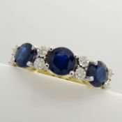 A 9ct yellow gold 11-stone alternate-set treated sapphire and diamond ring