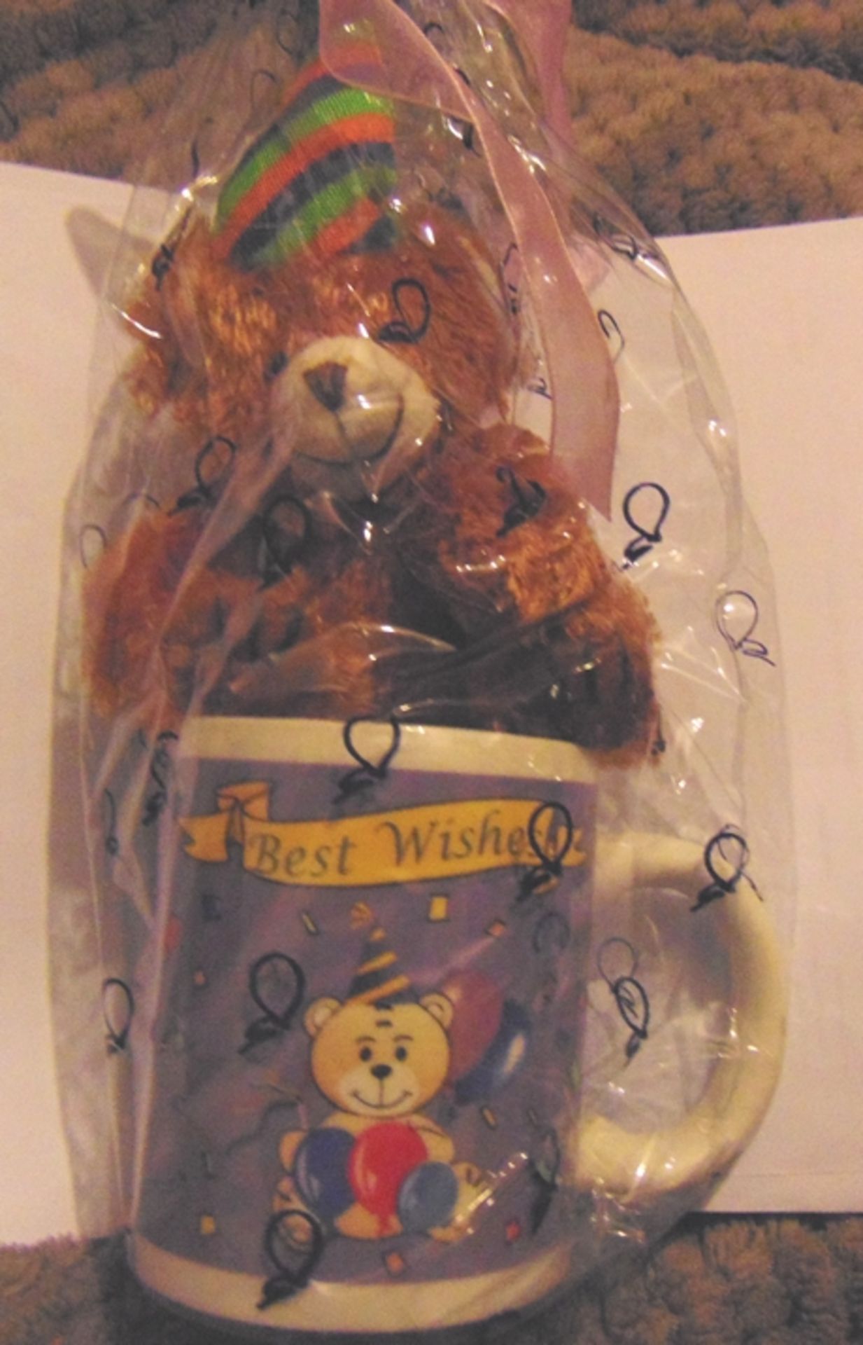 12 x mug and teddy bear with best wishes on them. rrp £7.99 each