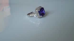 8.94ct Tanzanite surrounded by 1.71ct Diamonds, set in 18ct White Gold Ring