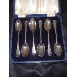 A cased set of six Edwardian Hanoverian scroll back coffee spoons. Holland, Aldwinkle & Slater. 190,