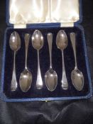 A cased set of six Edwardian Hanoverian scroll back coffee spoons. Holland, Aldwinkle & Slater. 190,