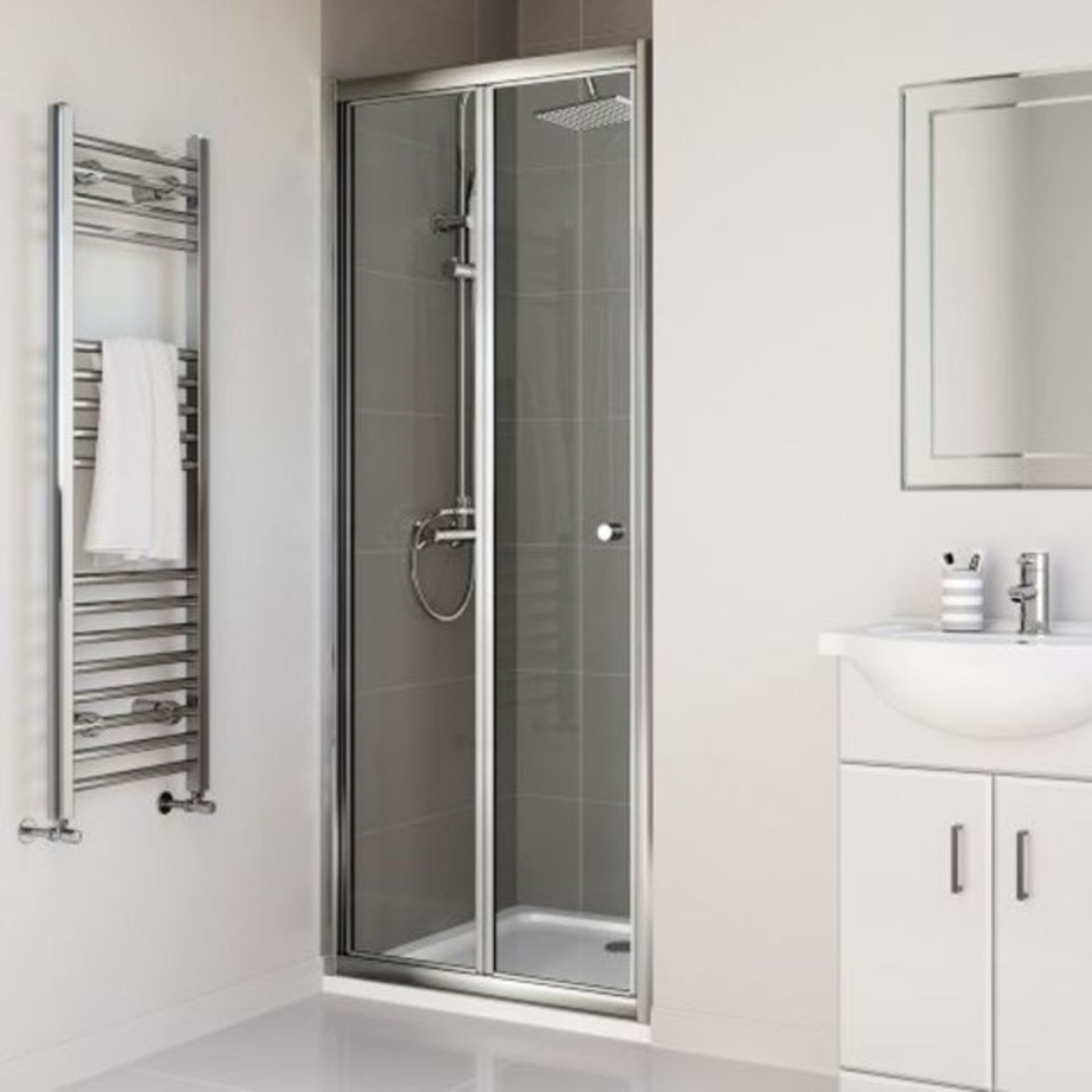 New (E52) 760mm - Elements Bi Fold Shower Door. RRP £299.99. Do You Have An Awkward Nook Or