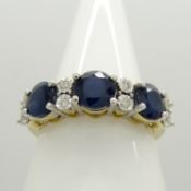 A 9ct yellow gold 11-stone alternate-set treated sapphire and diamond ring