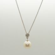 A 9ct white gold cultured pearl and daisy diamond cluster necklace, boxed