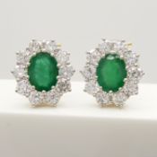 Stunning pair of 18ct yellow gold 3.60ct emerald and 3.00ct diamond cluster earrings