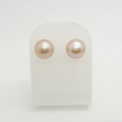 A boxed pair of round natural peach freshwater pearl studs in 9ct yellow gold