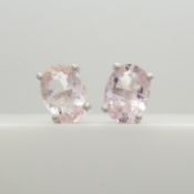 A pair of morganite and silver ear studs