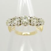 A certificated 18ct white and yellow gold 1.40 carat 5-stone graduated diamond ring