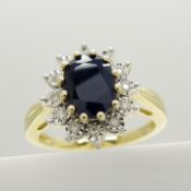 An attractive 9ct yellow gold oval-cut treated sapphire and diamond cluster ring