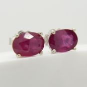 A pair of silver ear studs set with treated rubies, 1.70 carats (approx)