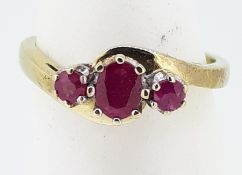 9ct (375) Yellow Gold Oval & Round Three Stone Ruby Crossover Ring