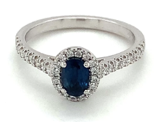 0.67ct dark blue oval sapphire and 0.24ct diamond ring set in platinum