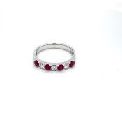 0.39ct ruby and 0.21ct diamond eternity ring set in 18kt white gold