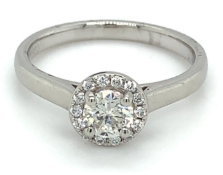 0.26ct round brilliant diamond set in a halo platinum setting