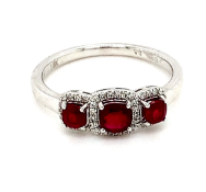 0.72ct cushion cut ruby and diamond ring set in 18kt white gold