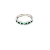 0.30ct emerald and 0.25ct diamond eternity ring set in 18kt white gold