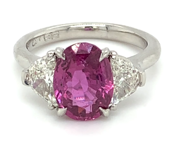 3.33ct oval pink sapphire and diamond ring set in platinum