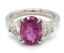 3.33ct oval pink sapphire and diamond ring set in platinum