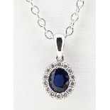 18ct White Gold 0.56ct Sapphire & Diamond Oval Cluster Pendant on Trace Chain - 20"