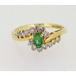 18ct (750) yellow Gold Oval Emerald & Diamond Crossover Cluster Ring
