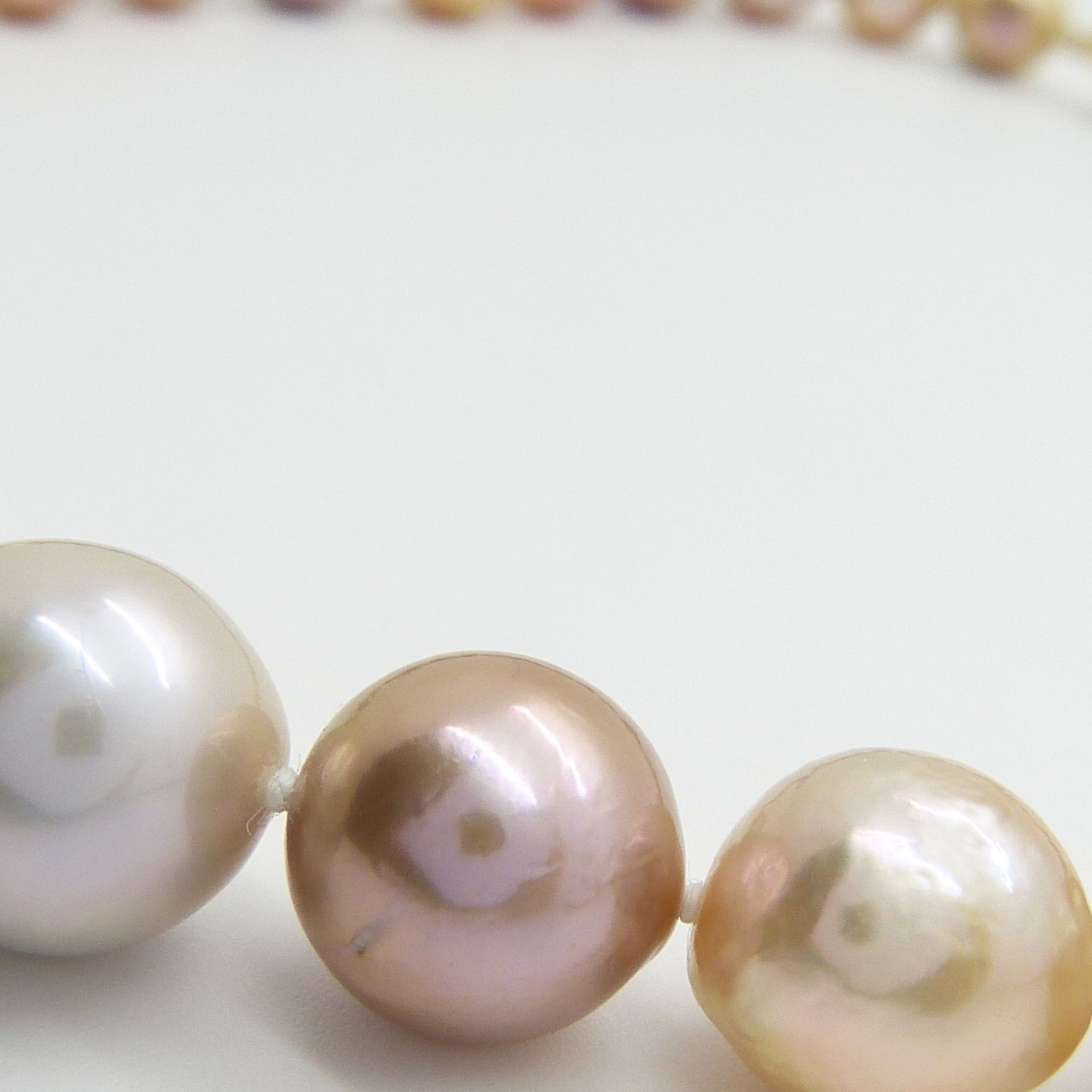 A necklace strung with peach, white, champagne and grey freshwater pearls with 9ct yellow gold clasp - Image 6 of 6