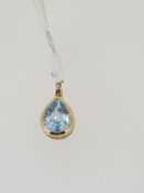 375 yellow gold pear cut topaz pendant