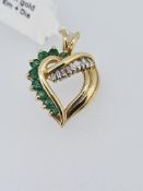 10ct yellow gold emerld and diamond heart pendant