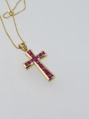 18ct yellow gold ruby set cross pendant