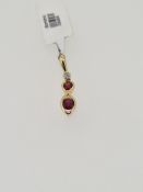 18ct yellow gold ruby and diamond pendant