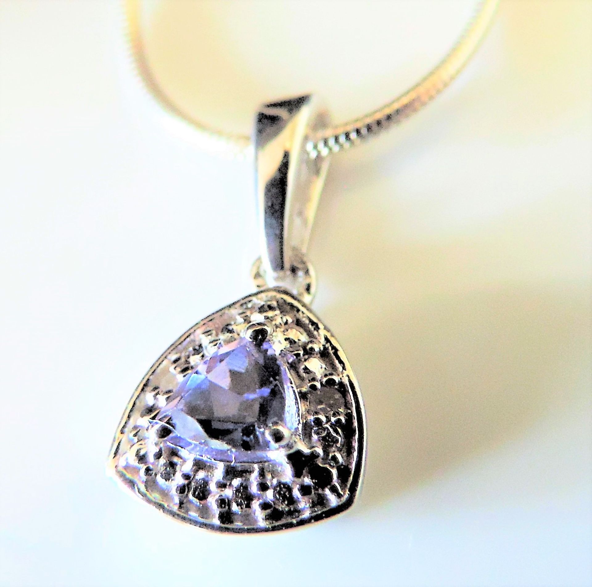 Sterling Silver Tanzanite Halo Pendant White Diamond 0.23ct