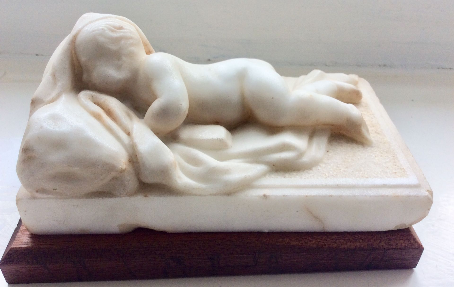 White Marble Sculpture of a Sleeping Child