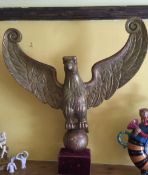 A Carved (possibly 17/18th century) Giltwood Eagle Perched on Orb