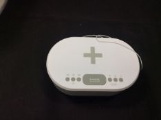 I-box dawn beside alarm clock with wireless charging