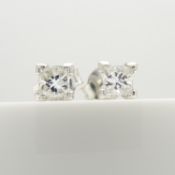 A sparkling pair of 0.51 carat princess-cut diamond solitaire studs, in 18ct white gold, boxed