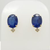 A pair of 18ct yellow gold oval-cut blue sapphire and round-cut diamond stud earrings