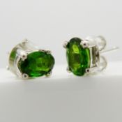 A pair of oval green chrome diopside ear studs in silver