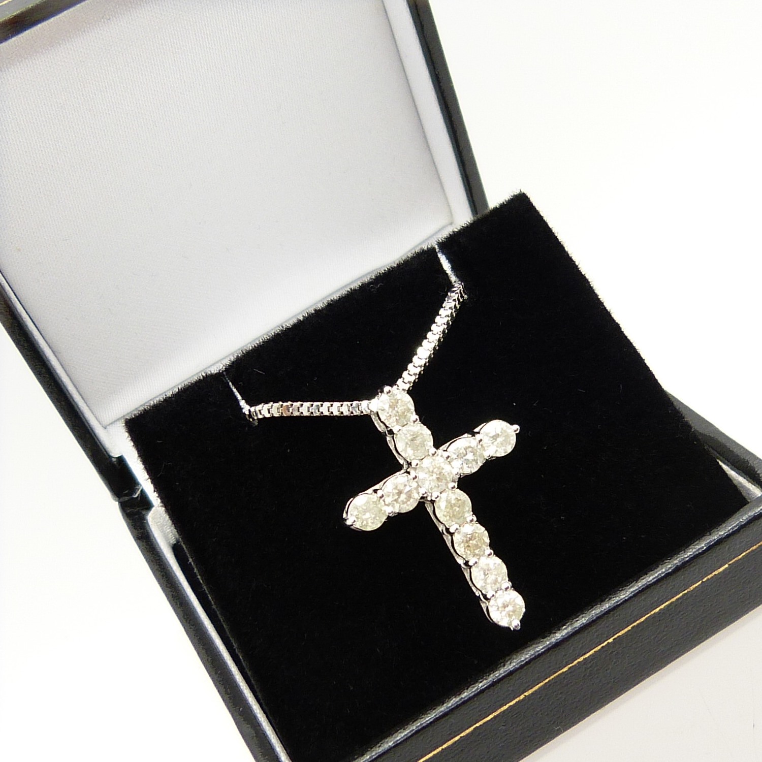 A 14ct white gold diamond cross pendant on a silver snake link chain, boxed - Image 5 of 6